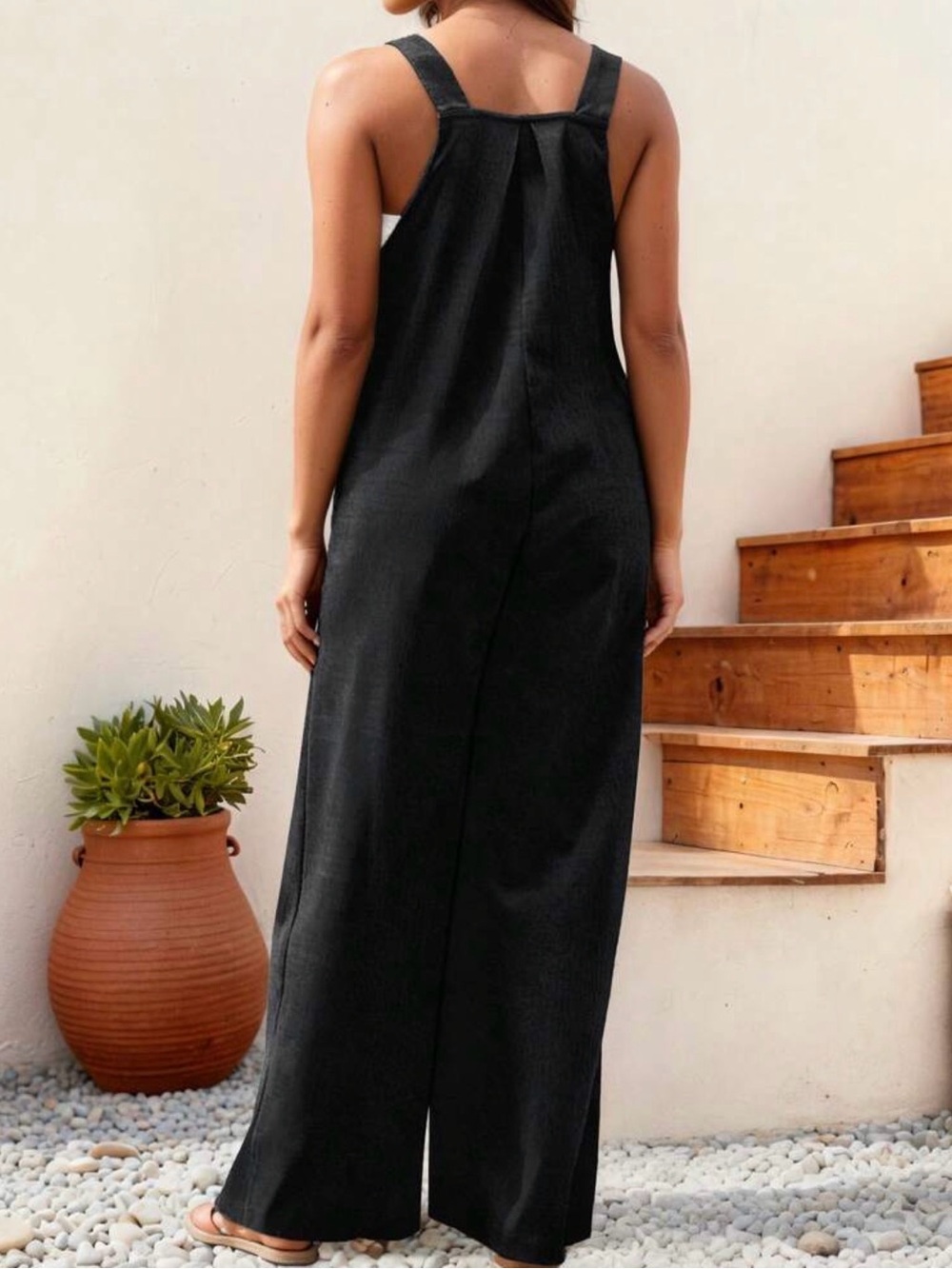 Black Sleeveless Jumpsuit/ overalls with adjustable button straps and pockets. - Picture 3 of 5